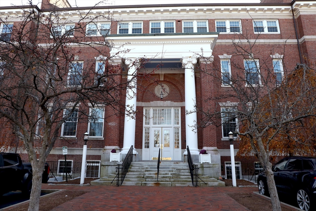 a front view of a building with glass windows