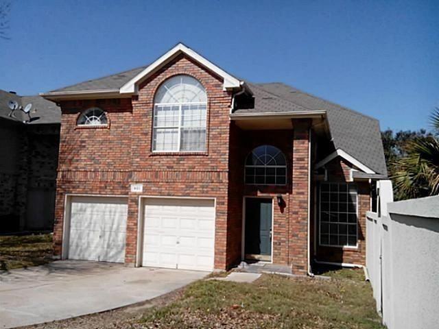 a front view of a house with a garage