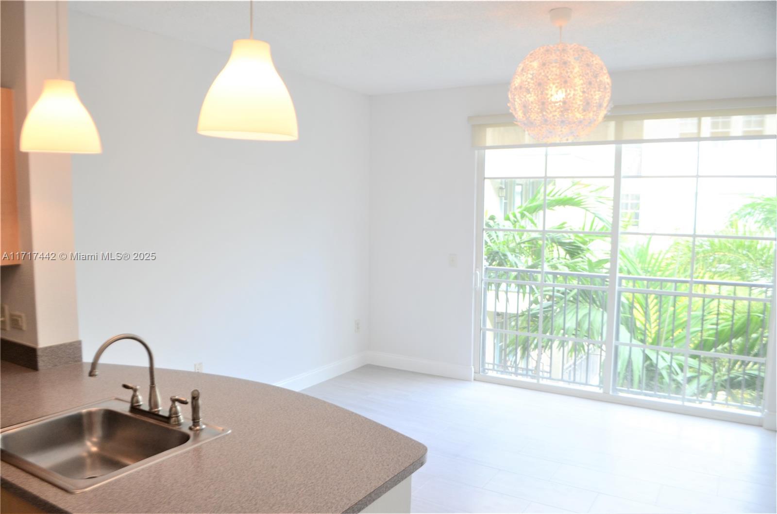 a bathroom with a sink and a large window