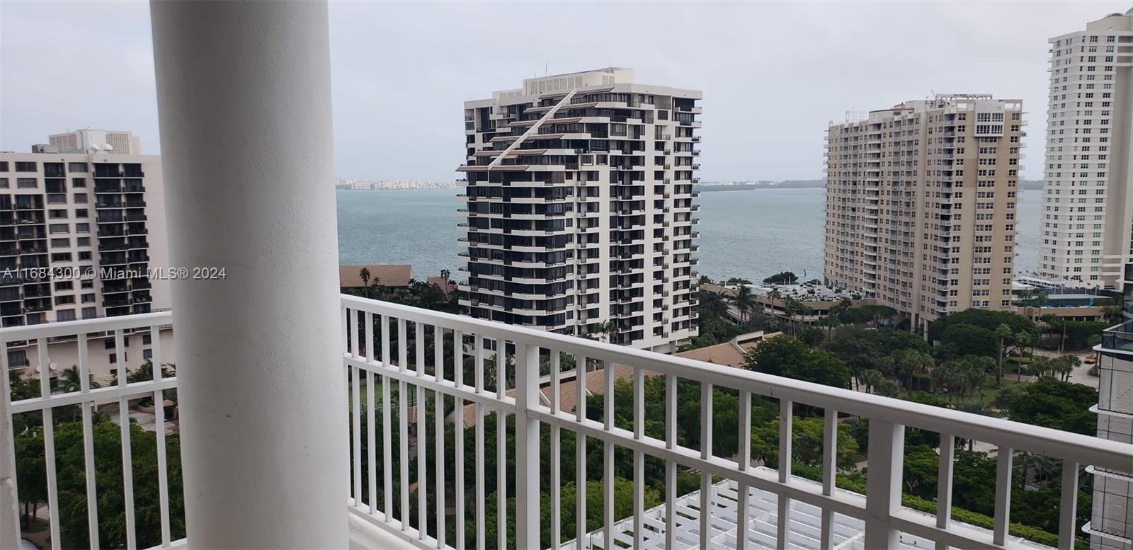 a view of balcony with a couple of buildings