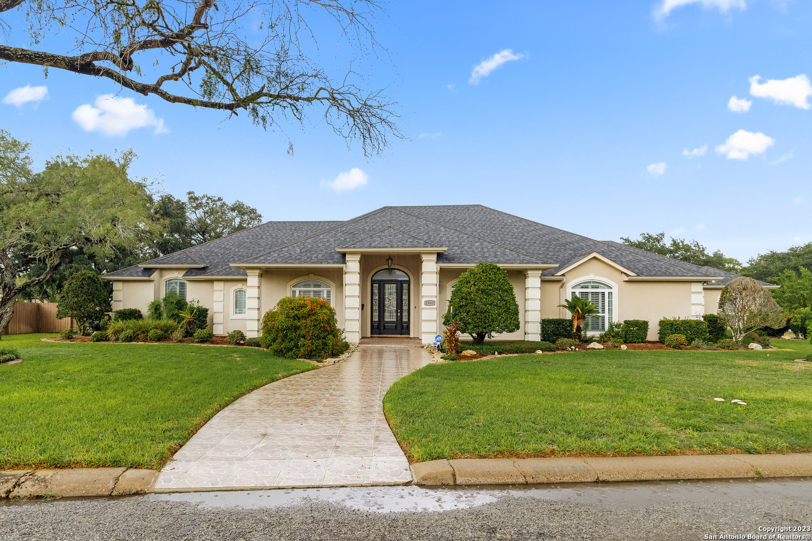 a front view of a house with a yard