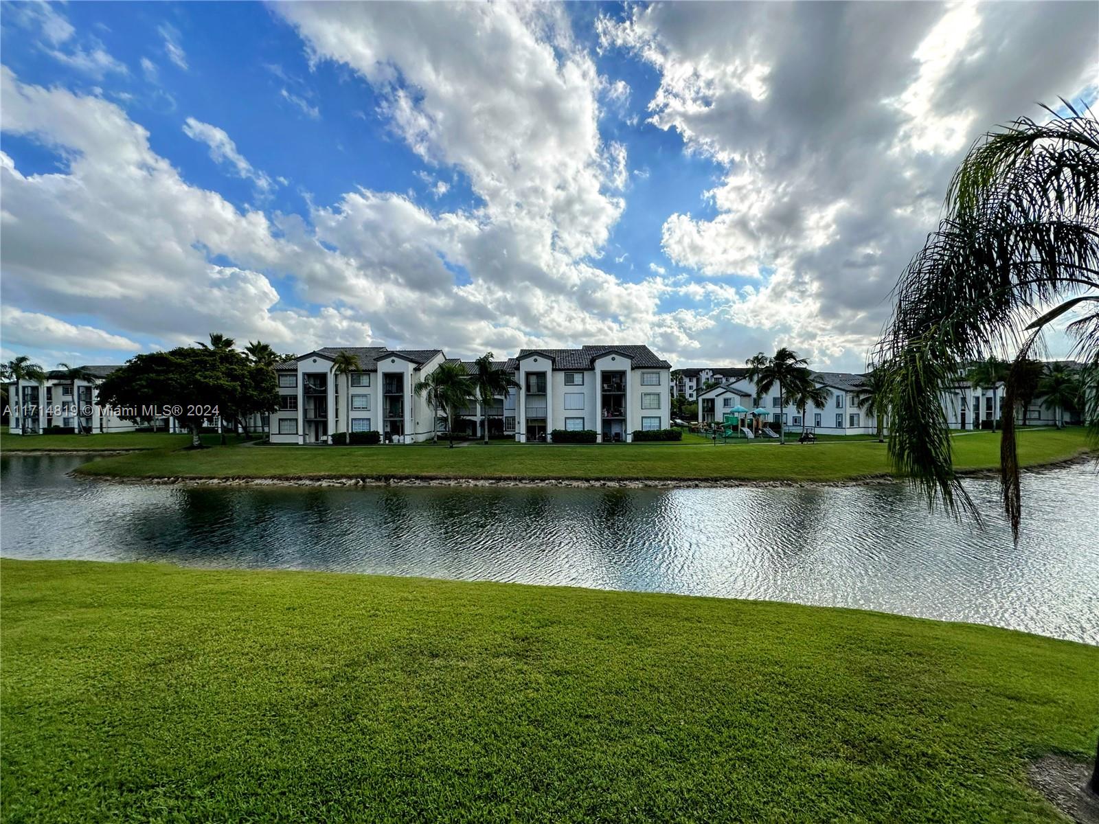 a view of a lake with a house in the background