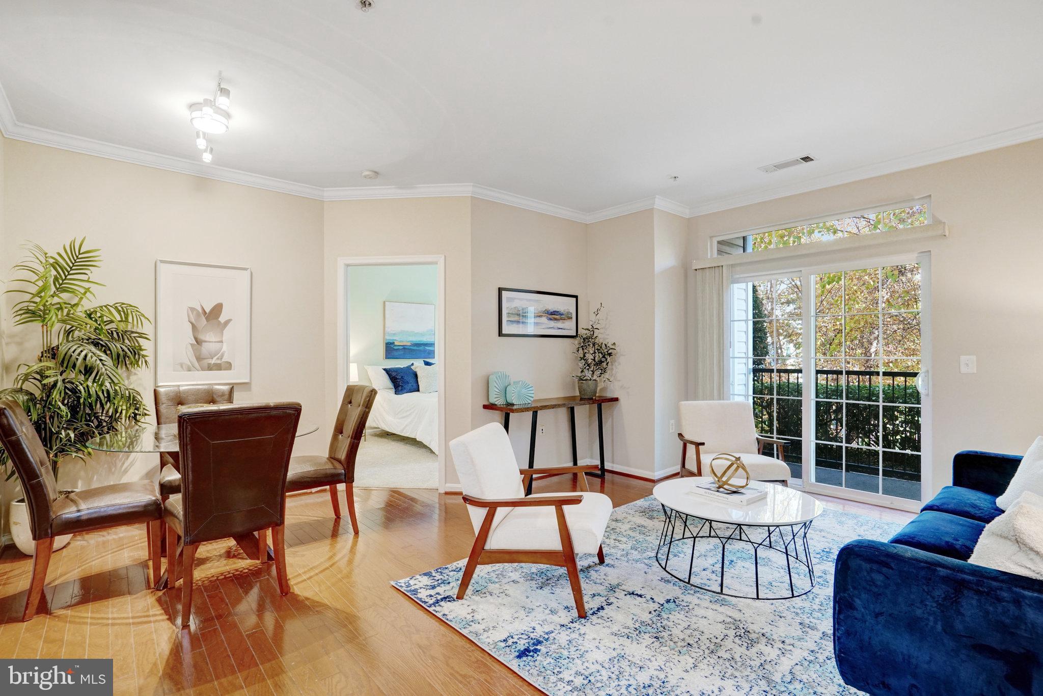 a view of a livingroom with furniture and wooden floor