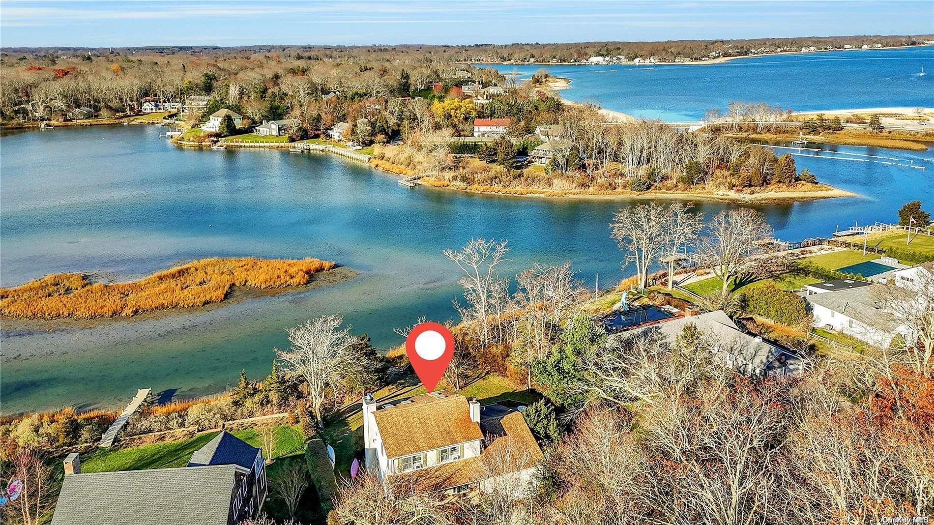 an aerial view of a house with a ocean view