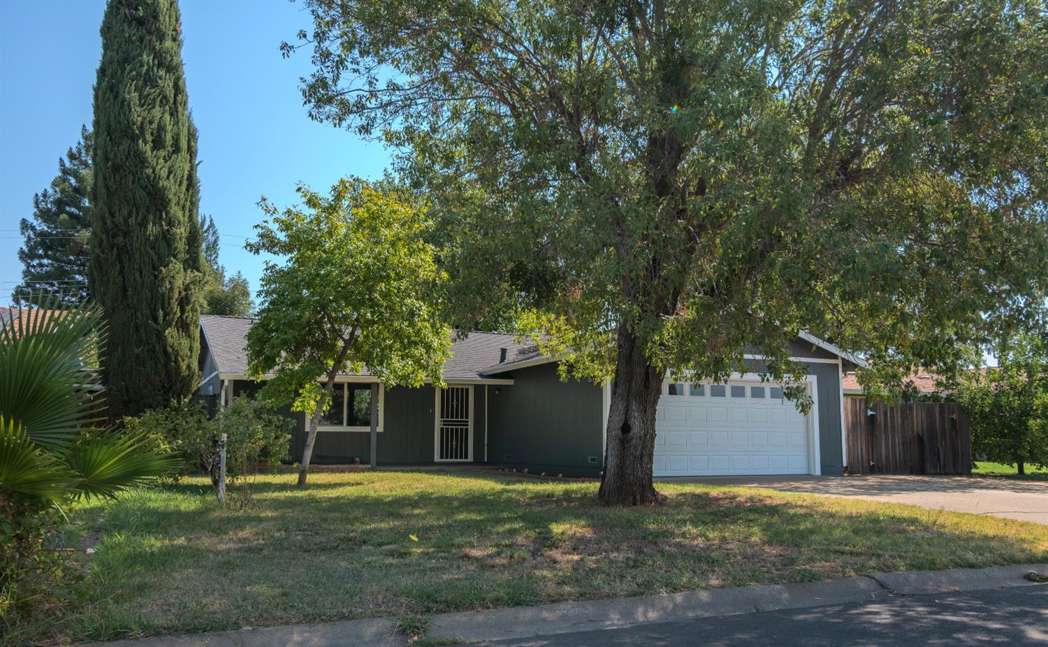 a house with trees in the background