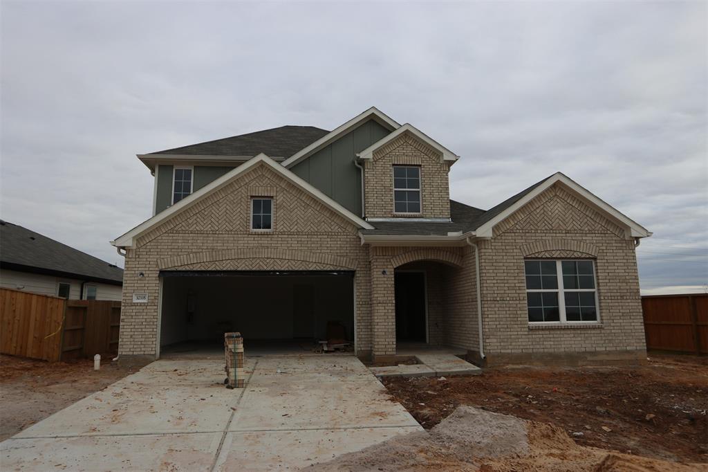 a front view of a house with yard