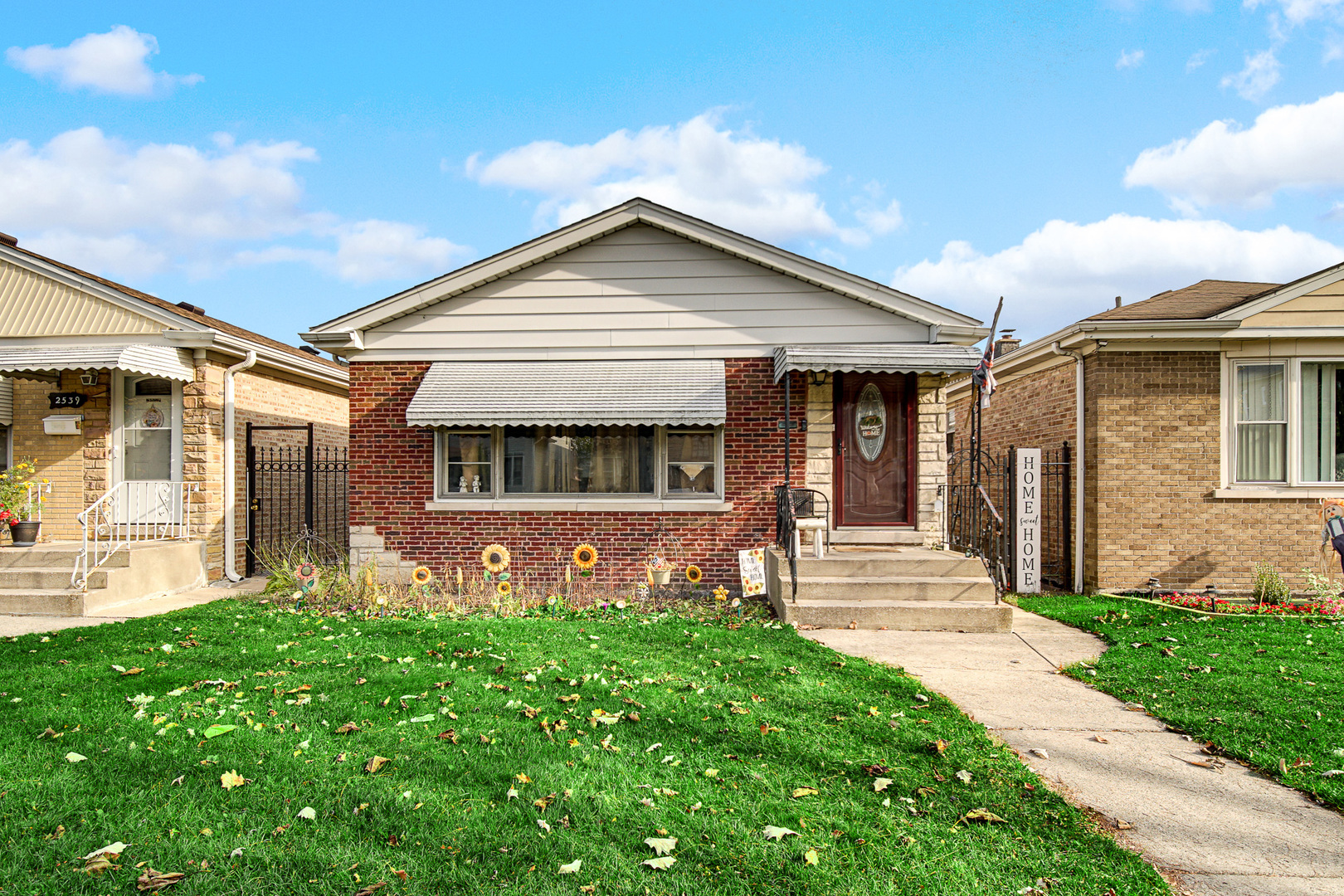 a front view of a house with garden