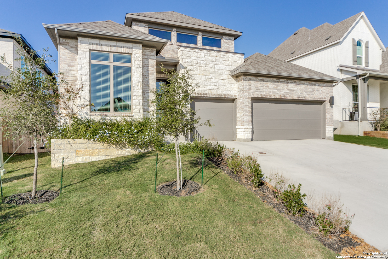 front view of a house with a yard