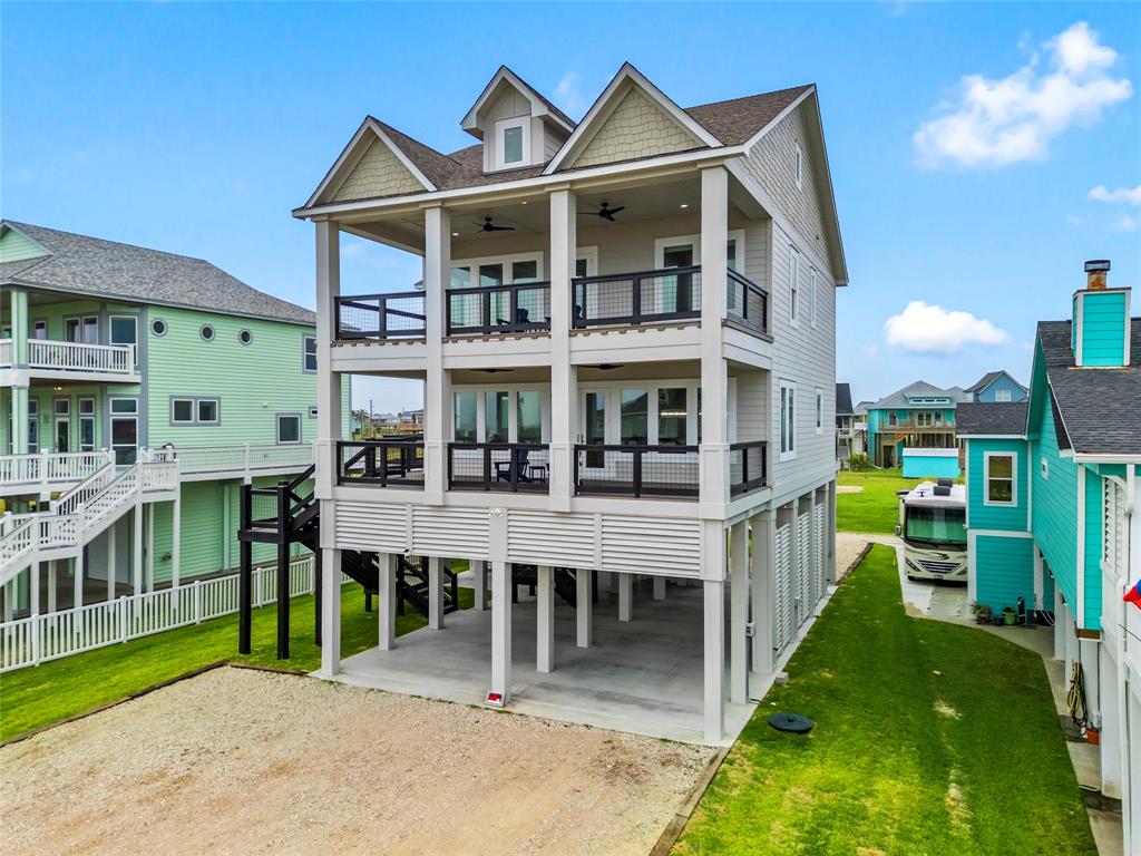 a view of a house with a yard and deck