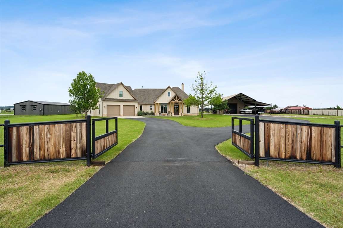 a view of a garden with wooden fence