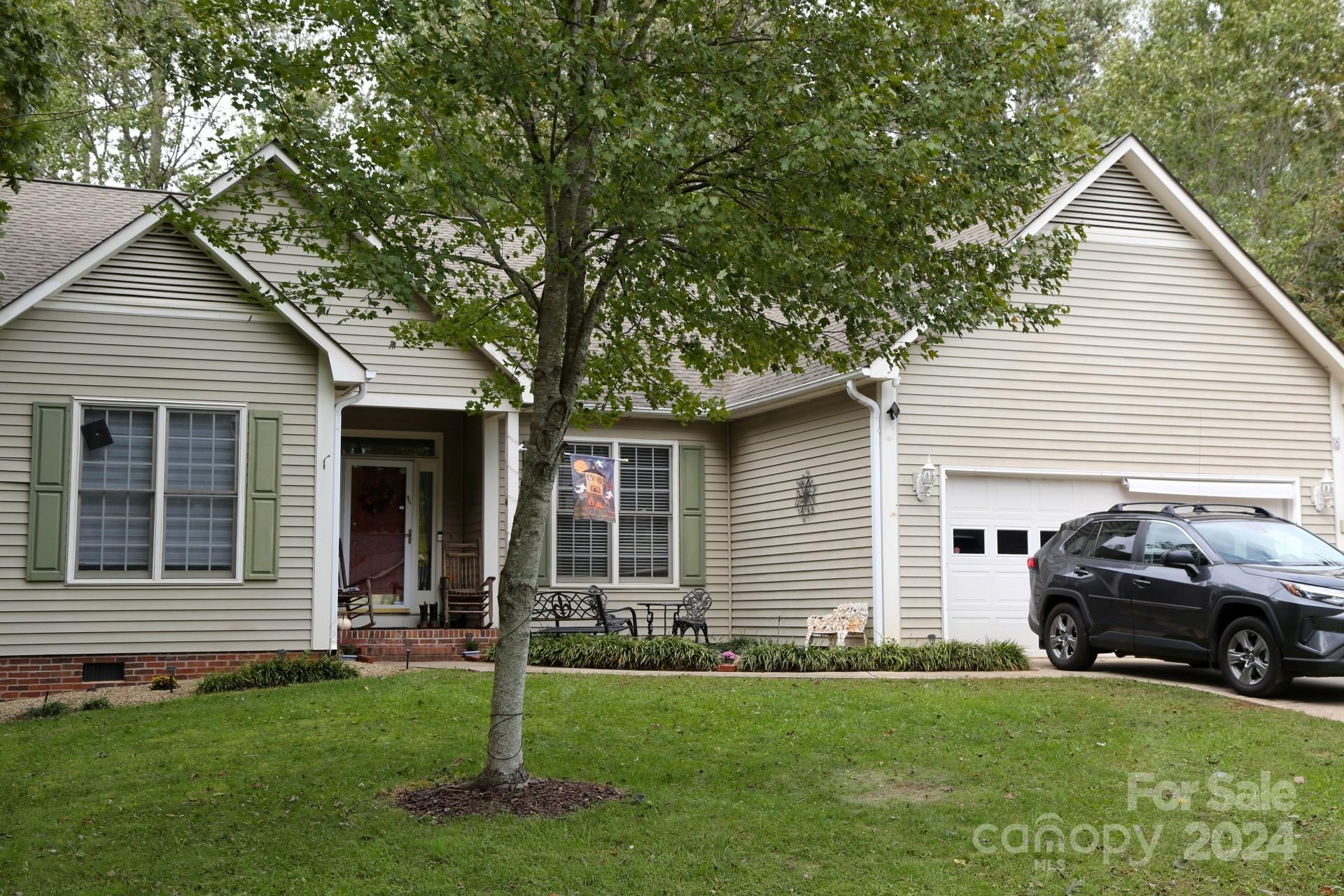 a house view with a garden space