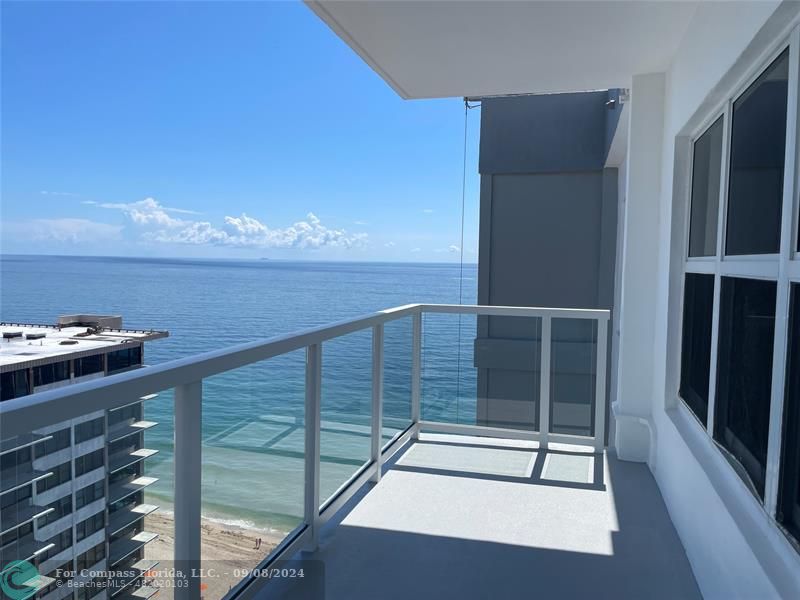 a view of balcony with furniture