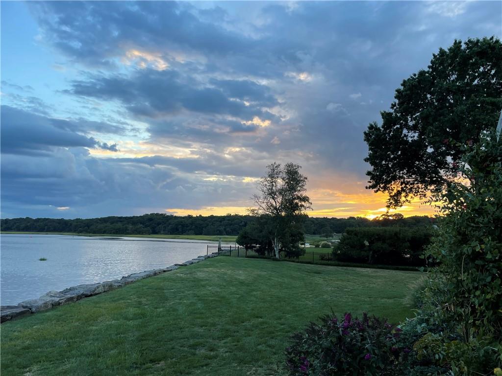 a view of a lake with a yard