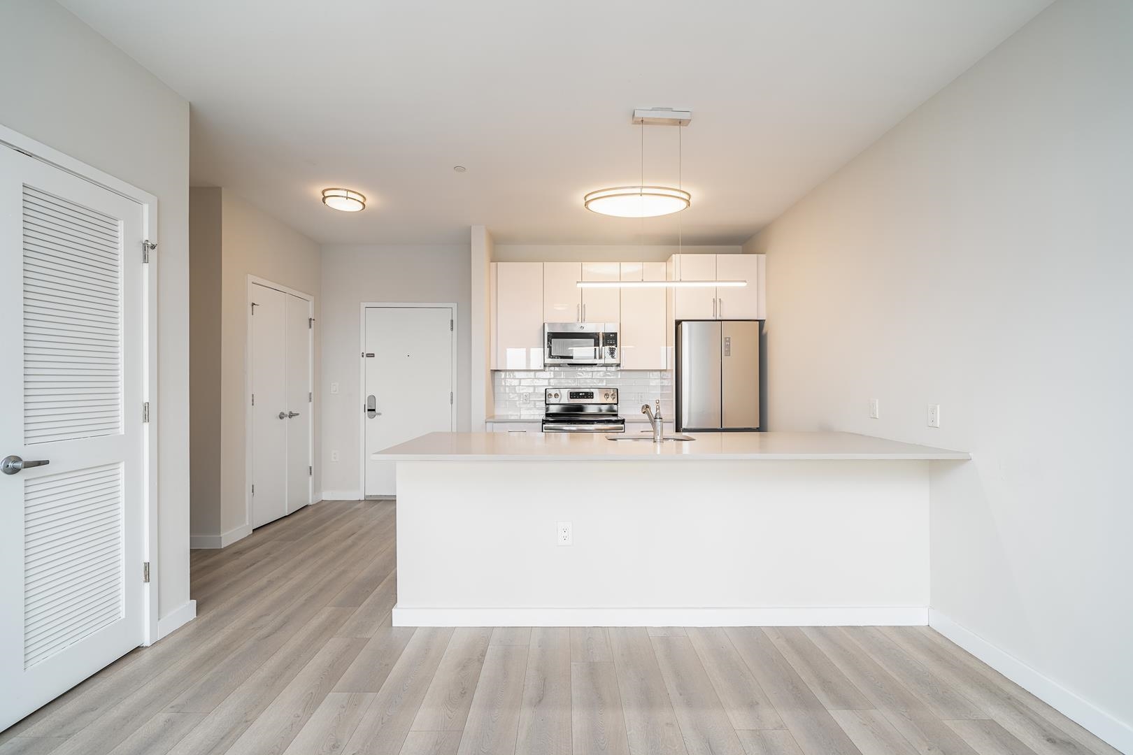 a view of kitchen with wooden floor