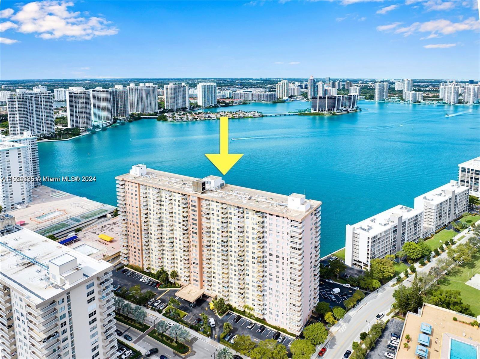 a view of a lake with tall buildings