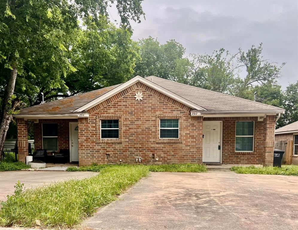 a front view of a house with yard