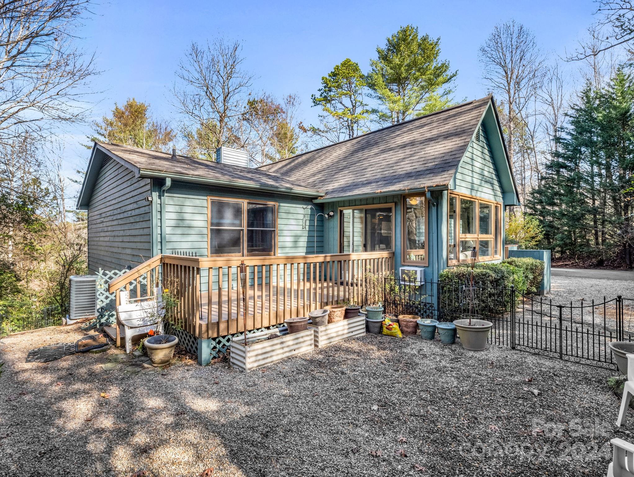 a view of a house with a yard and furniture