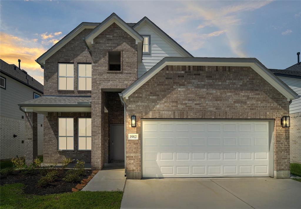 Welcome home to 1912 Scarlet Yaupon Way located in Barton Creek Ranch and zoned to Conroe ISD.