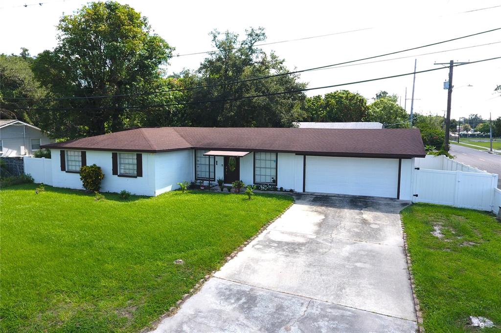 a view of a house with a yard