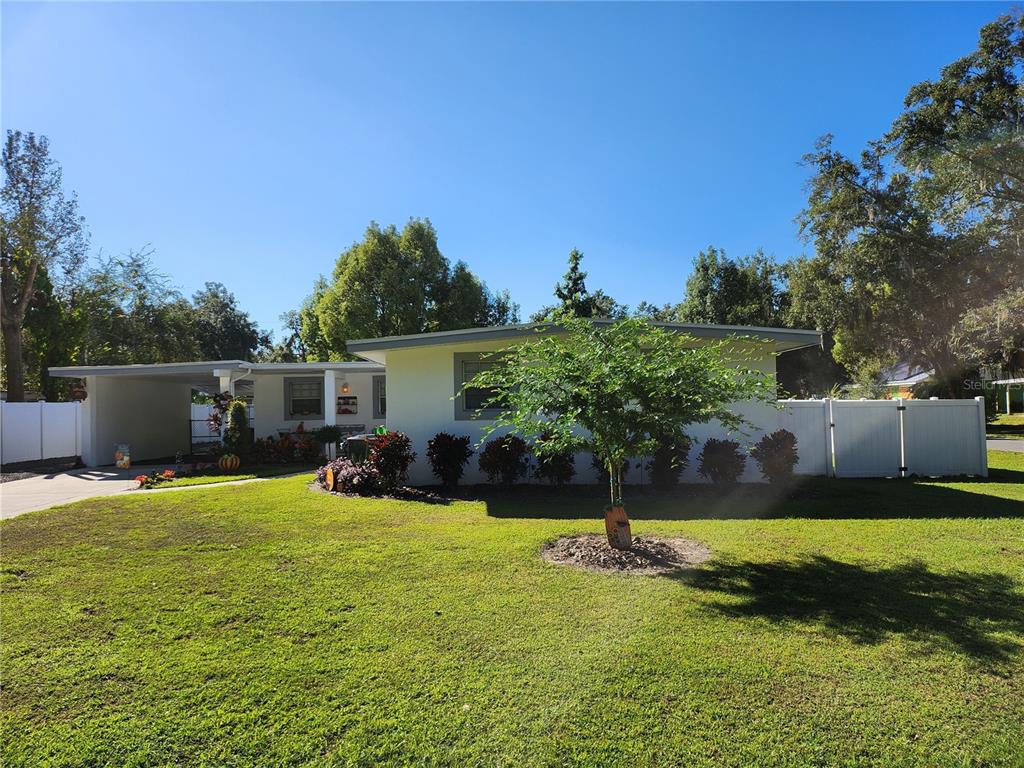 a view of a backyard with a sitting area