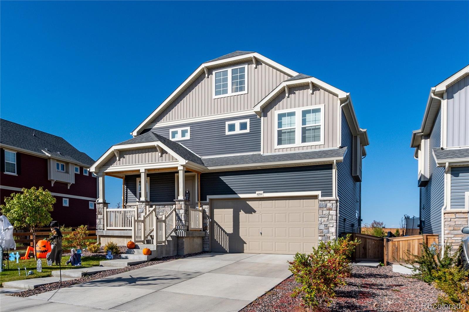 a front view of a house with garage