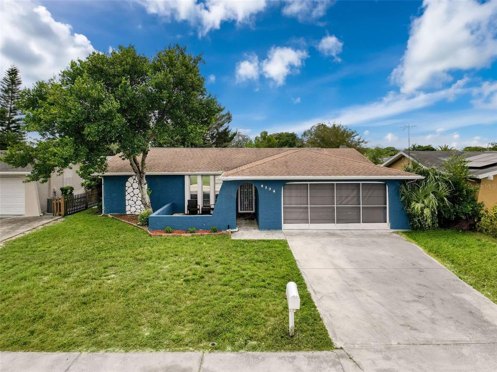 front view of a house with a yard