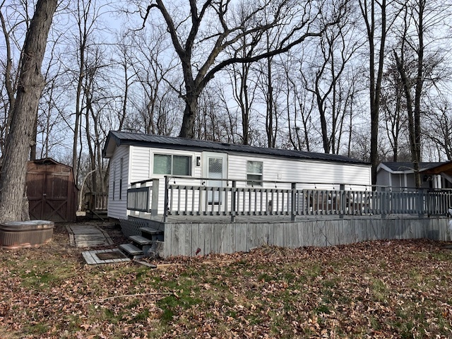 a view of a house with a small yard and wooden fence