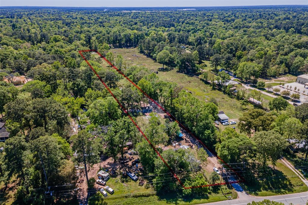 an aerial view of a houses with a yard