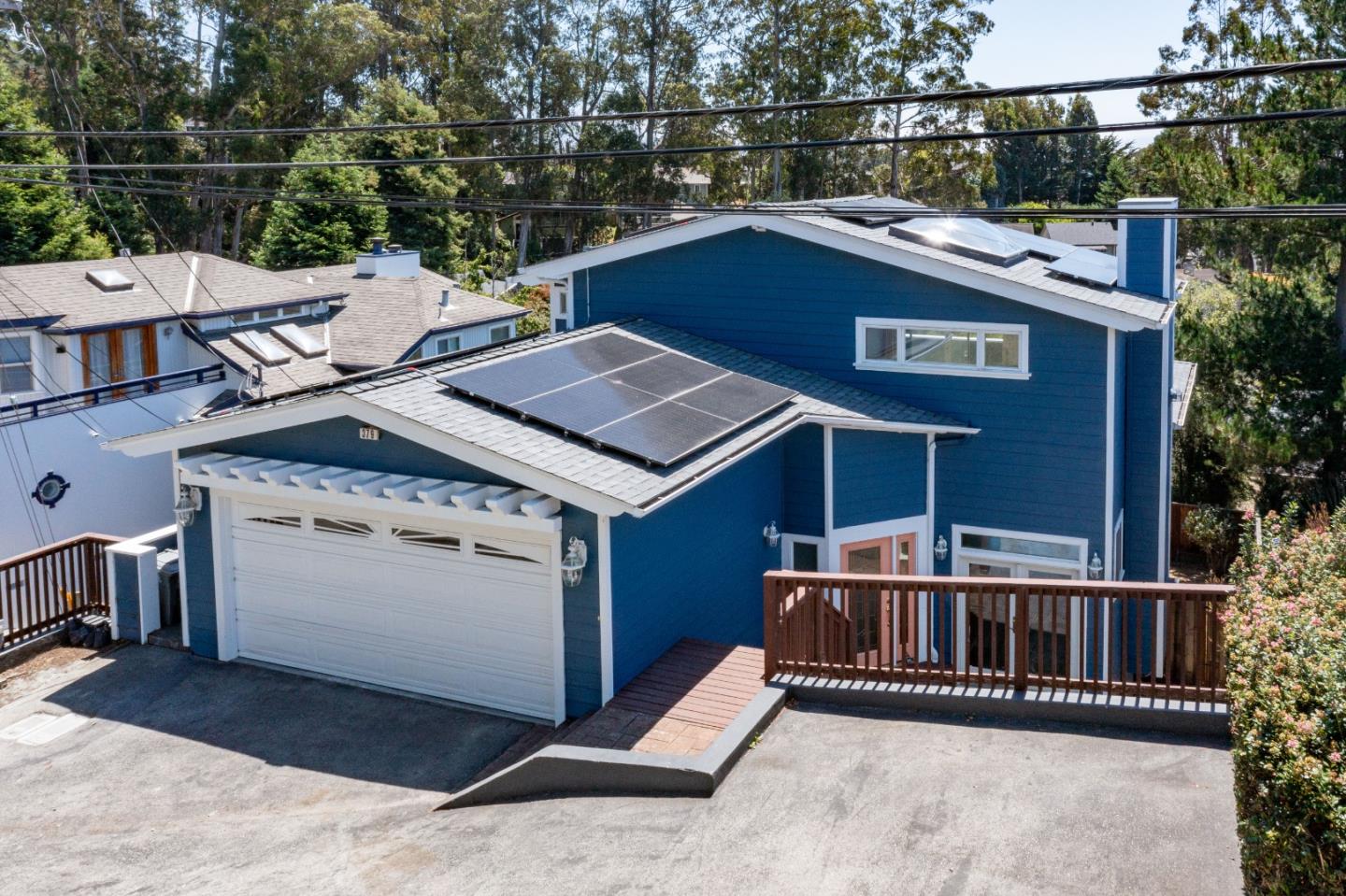 a roof deck with a table and chairs