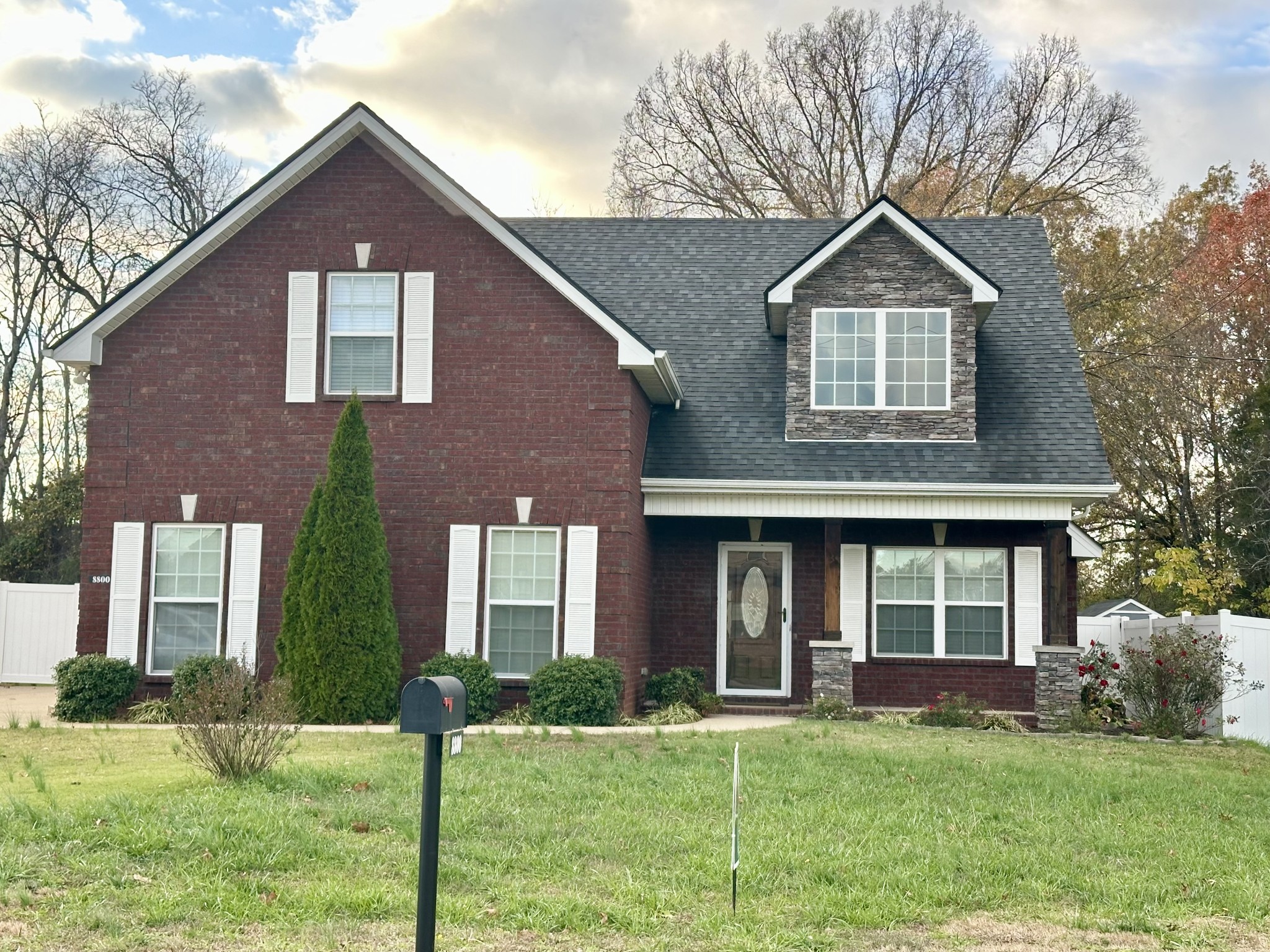 a front view of a house with a yard