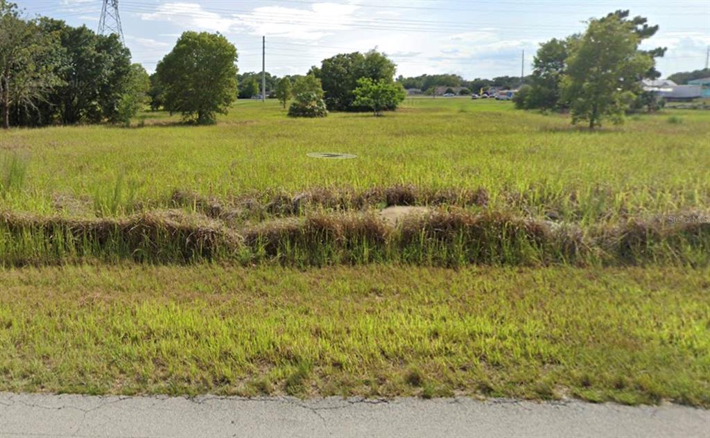 a view of a lake with a big yard