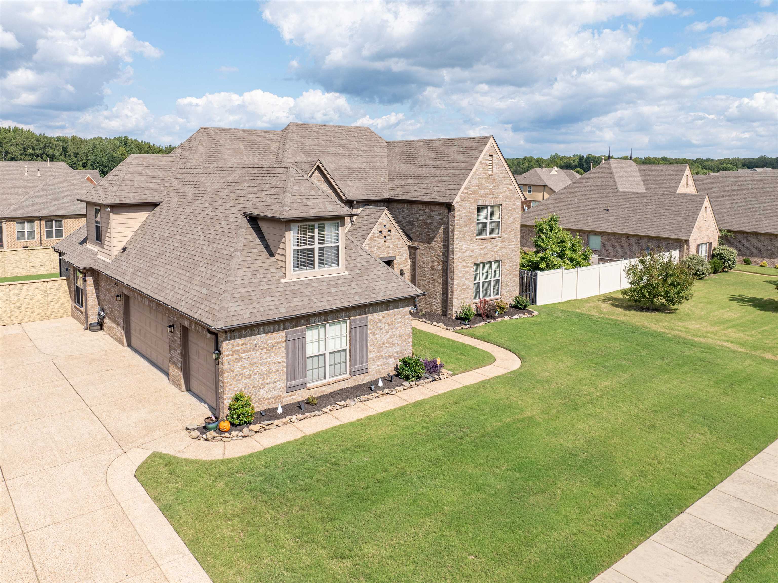 a aerial view of a house with a yard