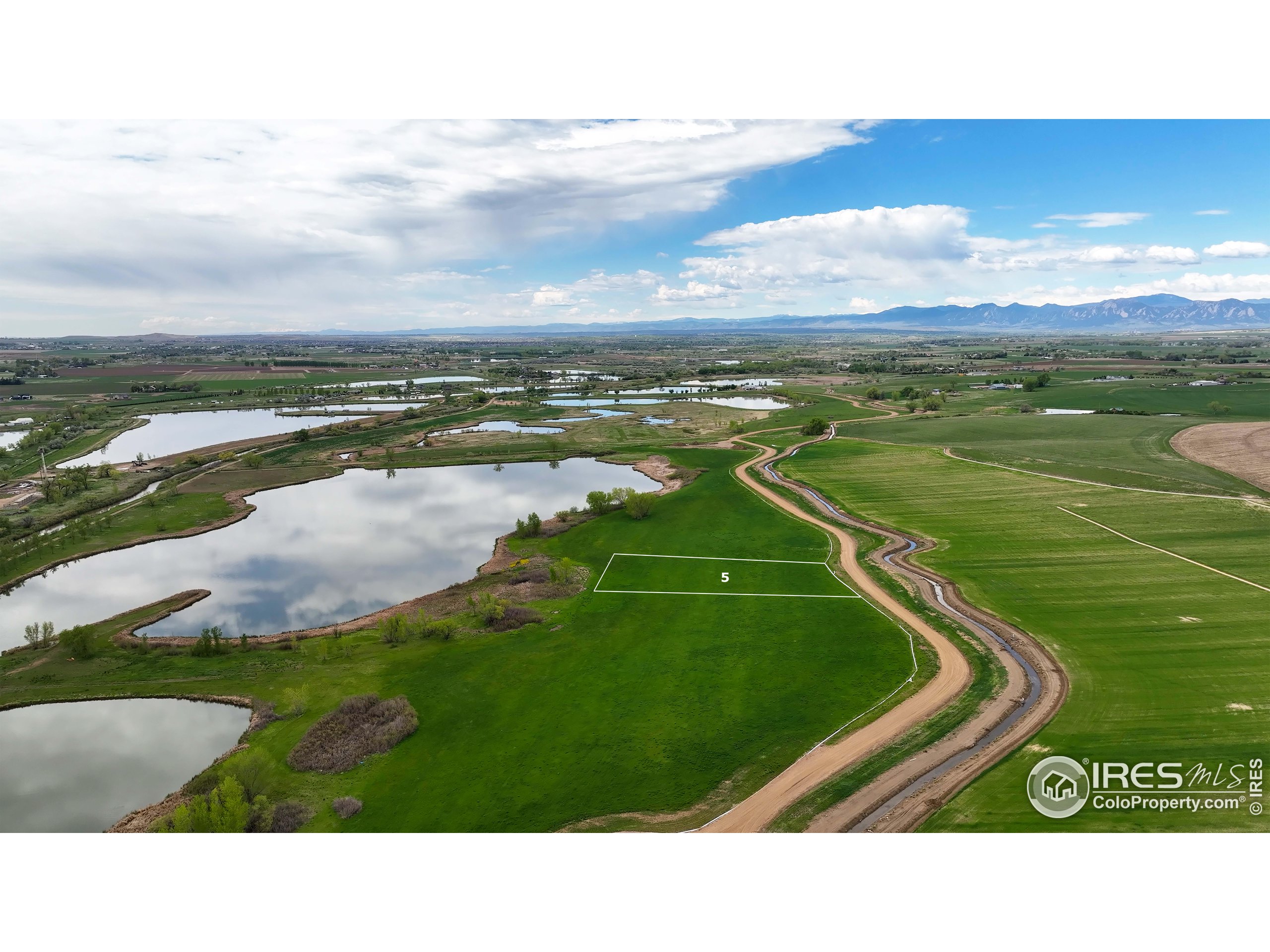 a view of a golf course with a lake