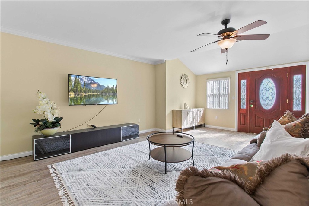 a living room with furniture and a table