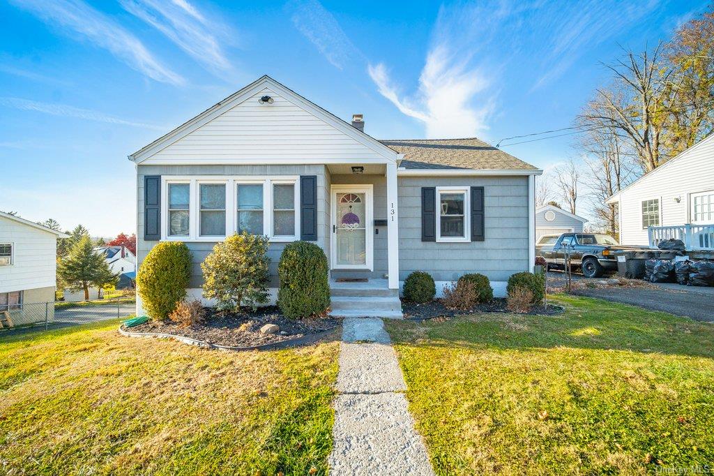 Bungalow-style home featuring a front yard