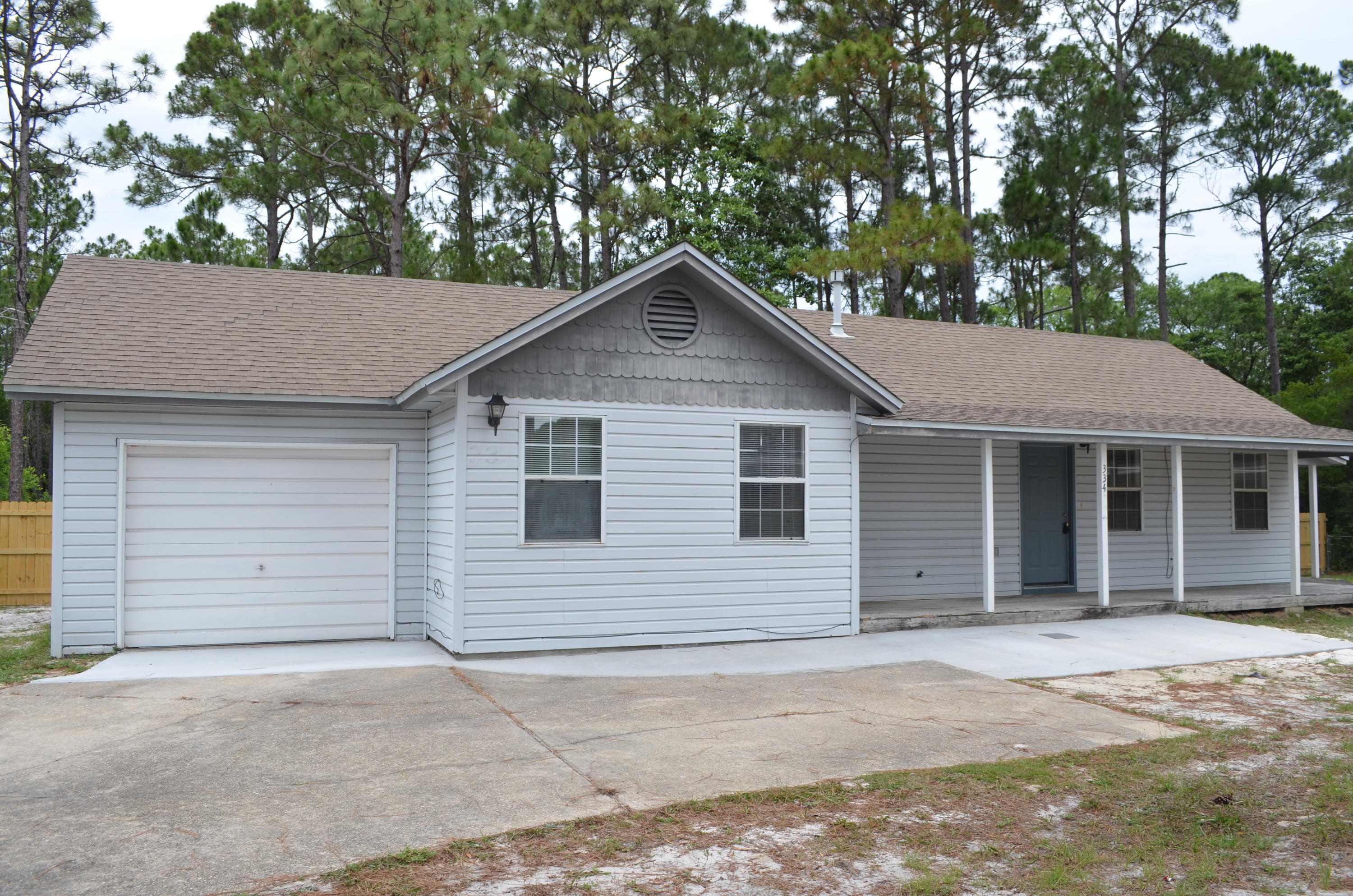 a house with a yard and garage