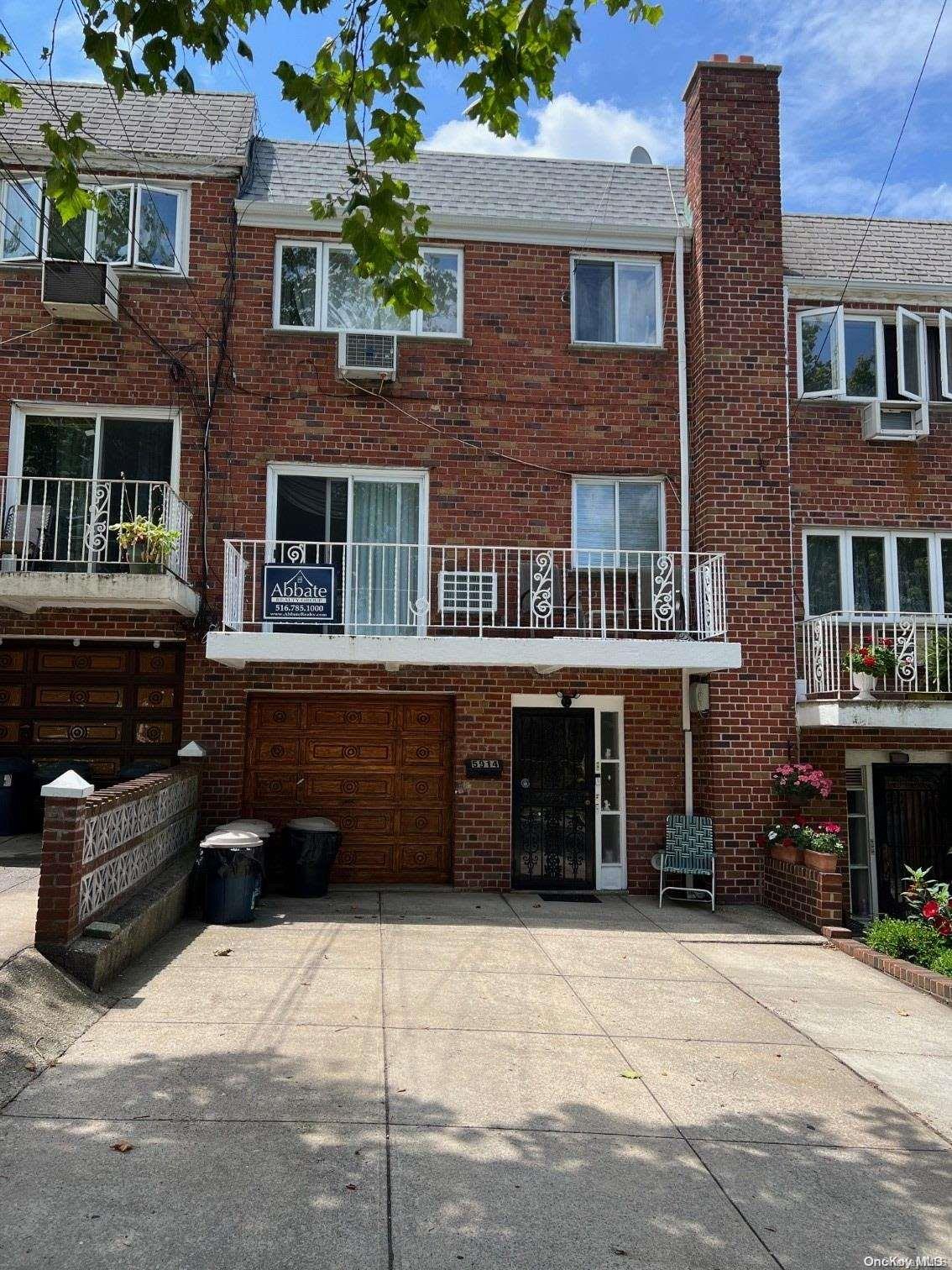 a front view of a house with parking space