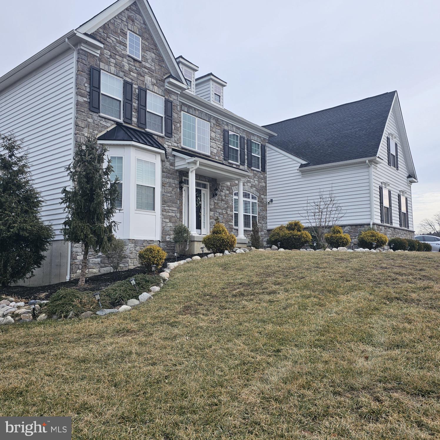 a front view of a house with a yard