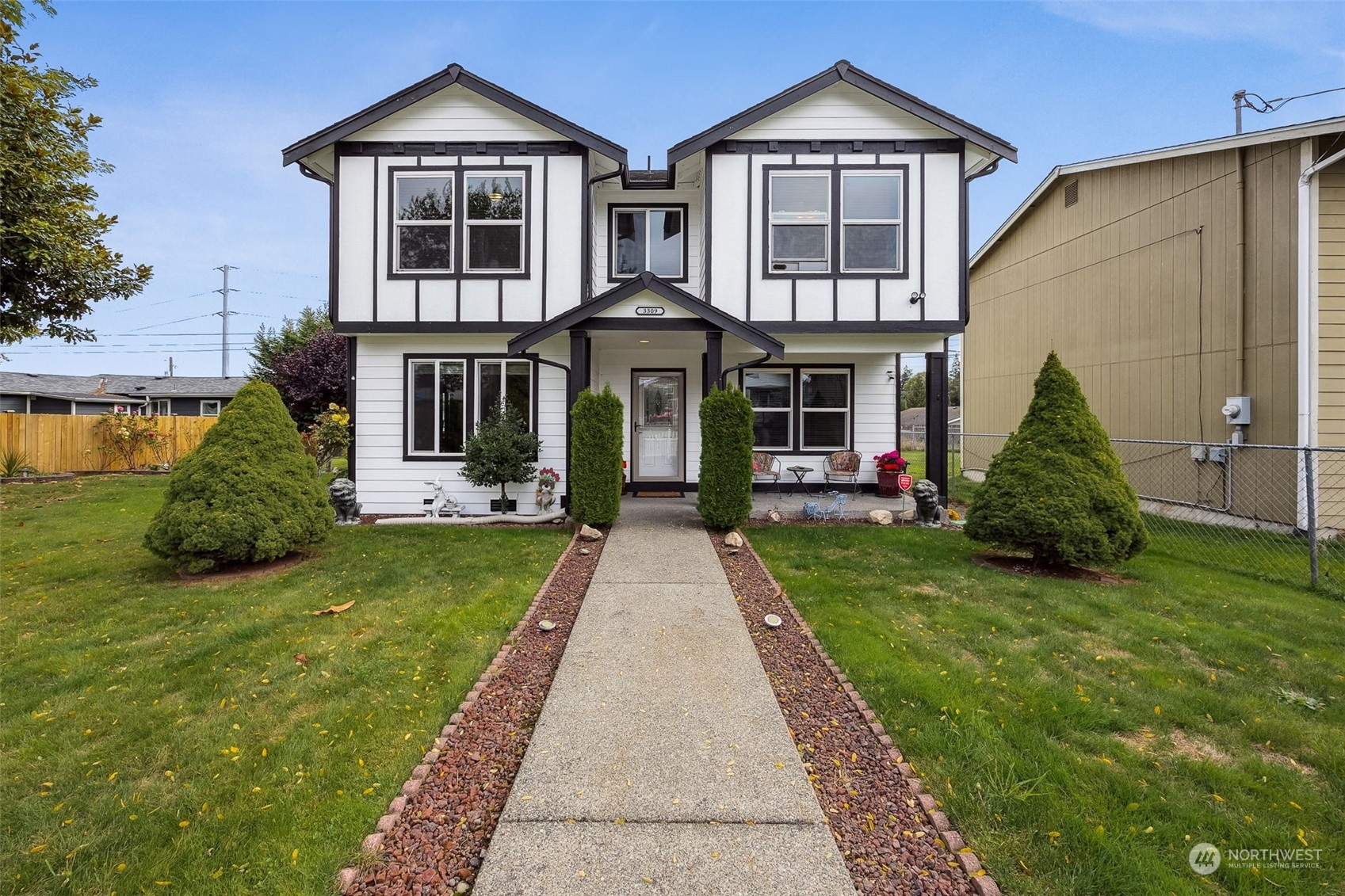 a front view of a house with a yard