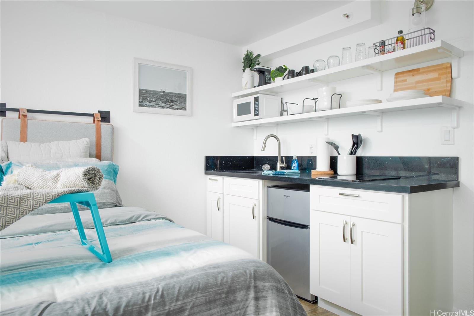 a kitchen with a sink dishwasher and cabinets