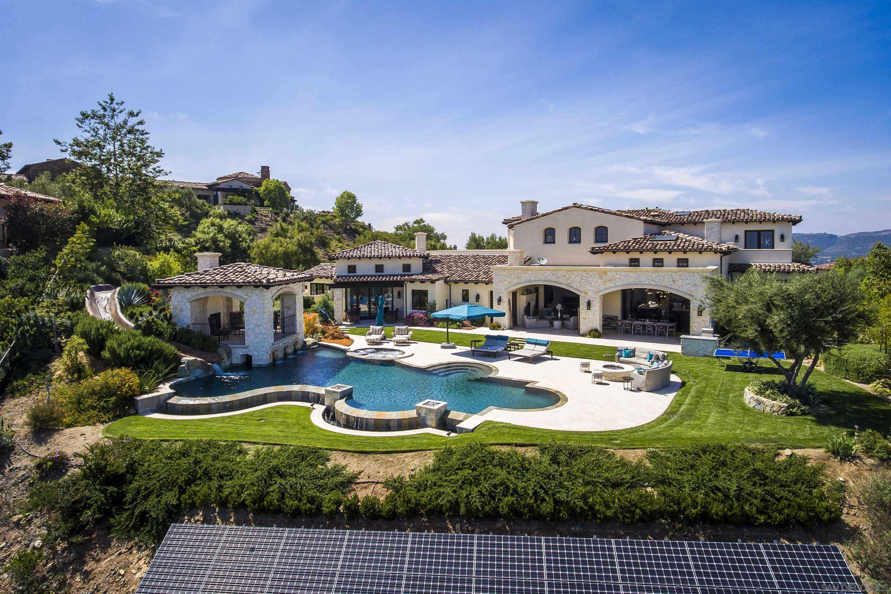 a view of a swimming pool with a patio