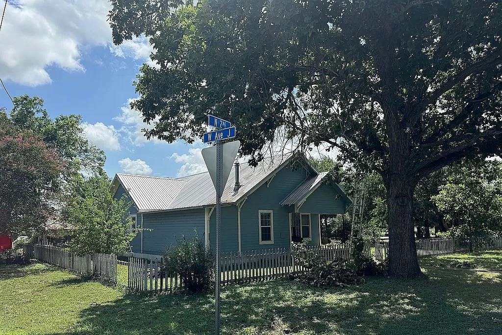 a front view of house with garden