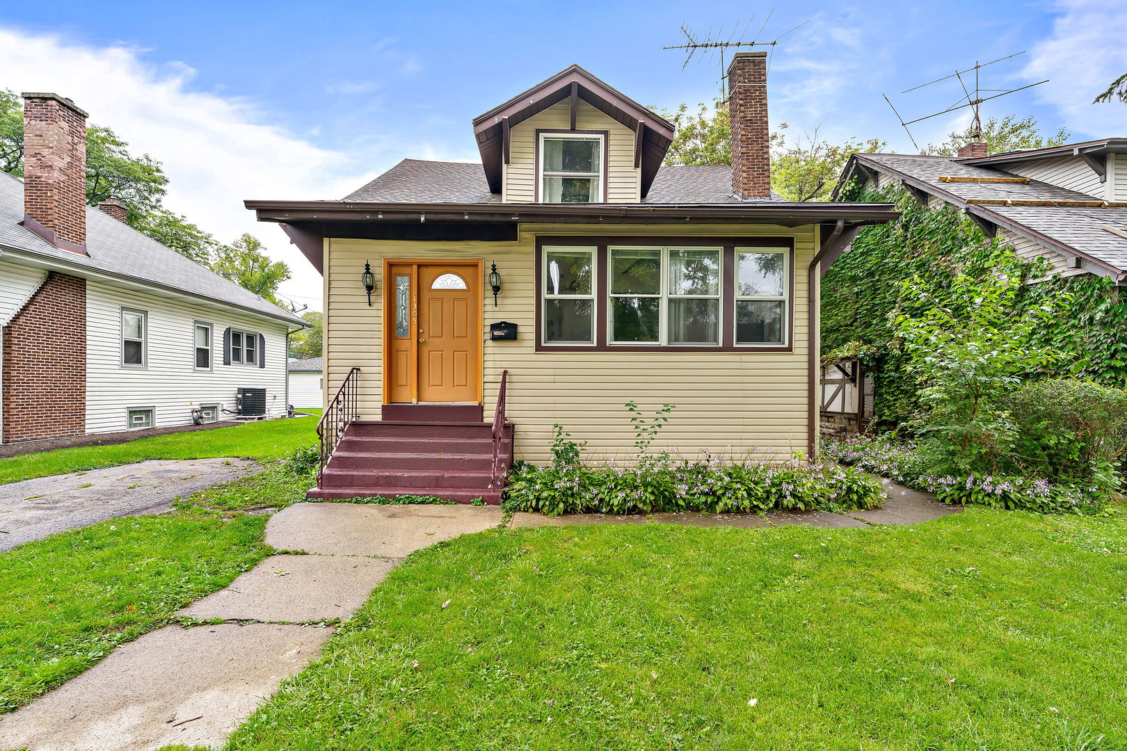 a front view of a house with garden