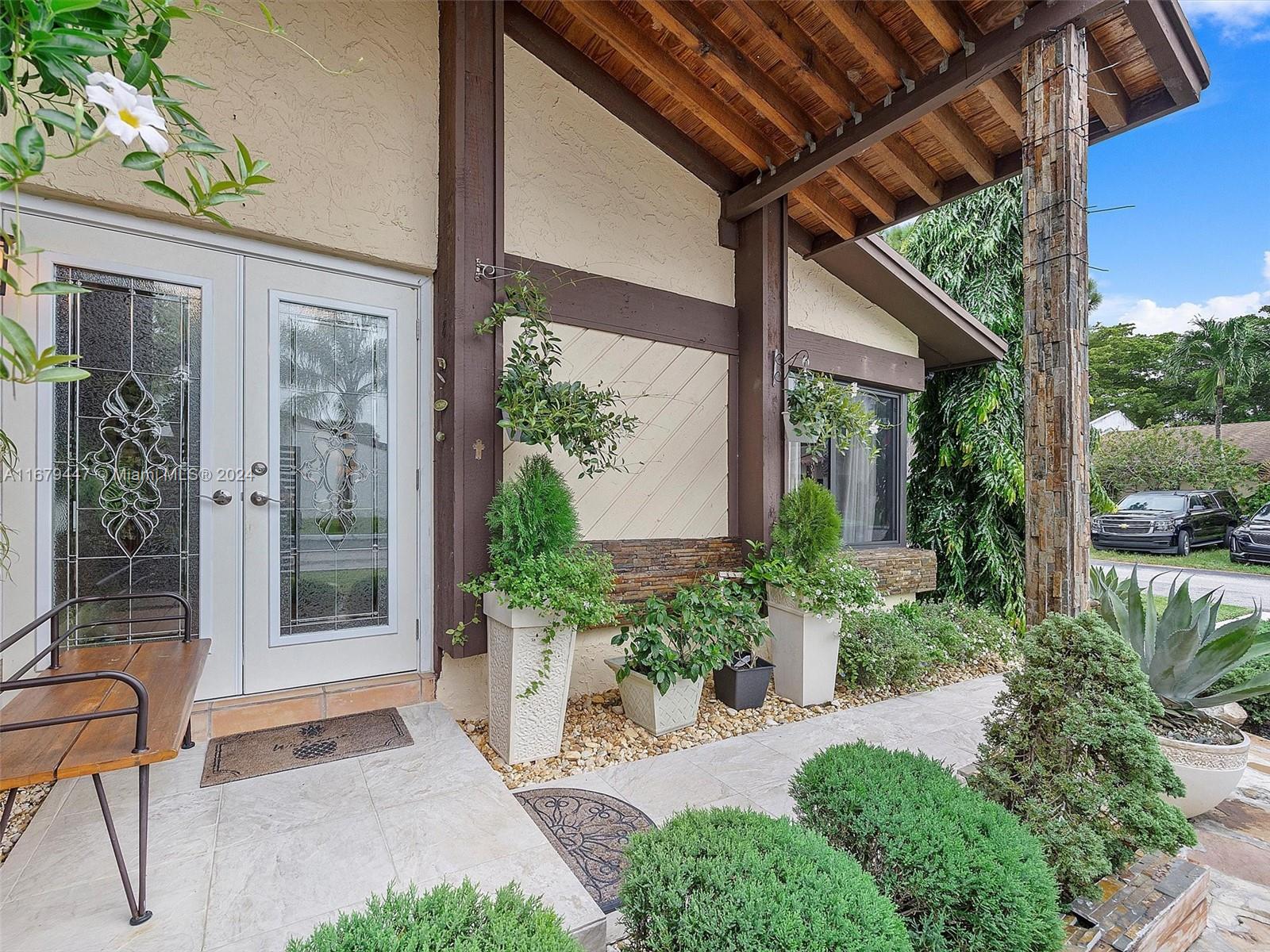 a front view of a house with garden