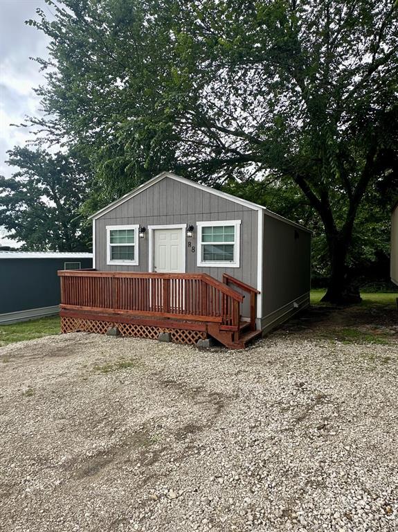 a house with trees in the background