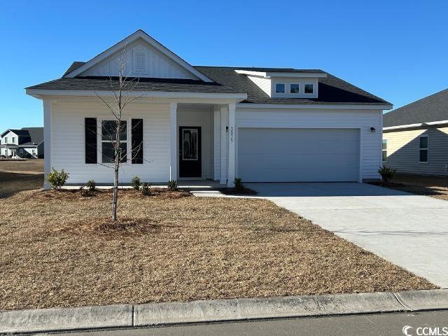 Ranch-style home with driveway and an attached gar