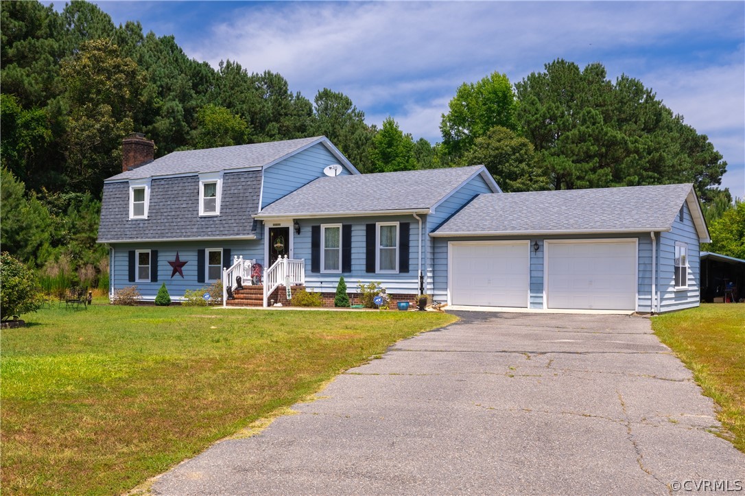 a front view of a house with swimming pool having outdoor seating