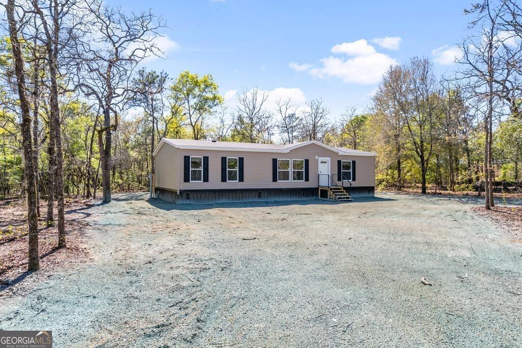 a house with trees in front of it