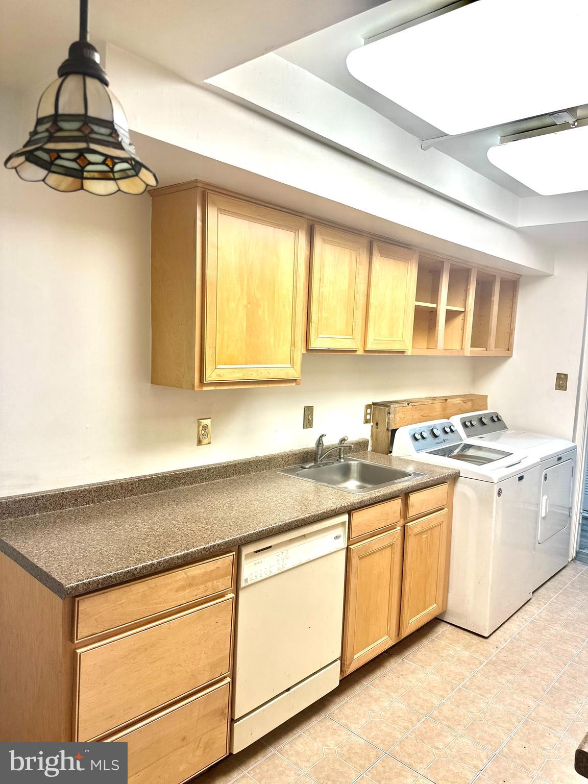 a kitchen with stainless steel appliances granite countertop a sink and a stove