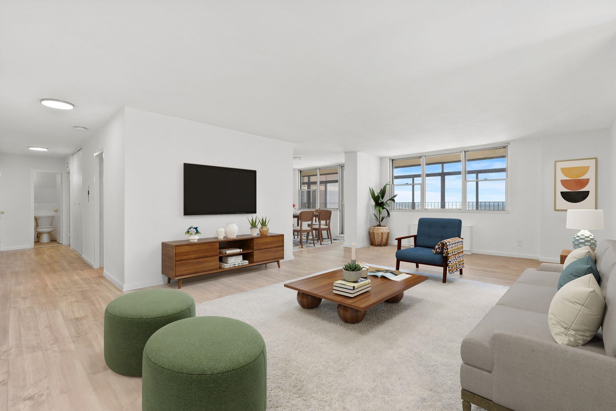 a living room with furniture and a flat screen tv